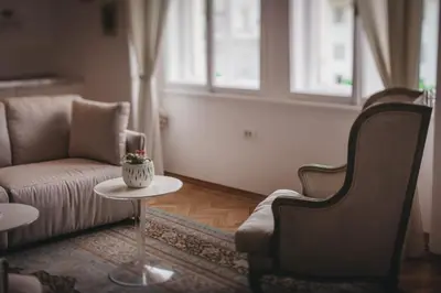a living room with a couch and a table at AB Ljubljana - Prince Filip Apartment in Ljubljana