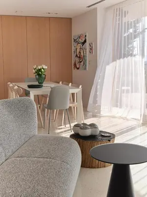 a living room with a couch and a table at Villa Alma Vista in Dobrovo