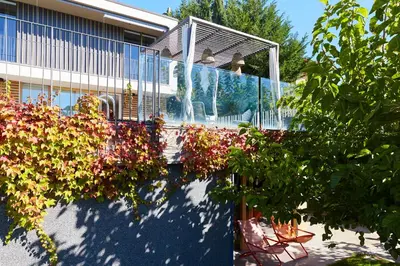a bunch of flowers in front of a building at Villa Alma Vista in Dobrovo