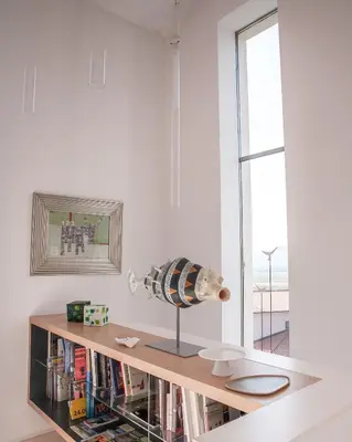 a room with a book shelf with a vase on it at Villa Alma Vista in Dobrovo
