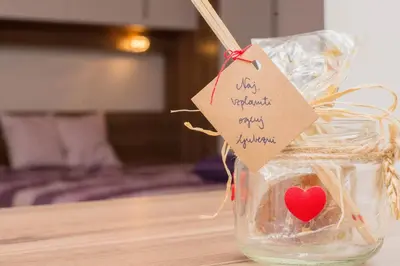a heart in a glass jar with a tag on it at MTM apartment in Bled