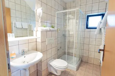 a bathroom with a toilet and a sink at Župančičev hram in Dragatuš