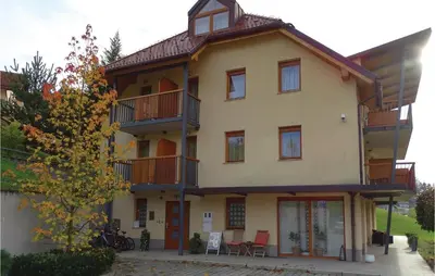a large house with balconies on the side of it at Stunning Apartment In Lasko With Wifi in Laško