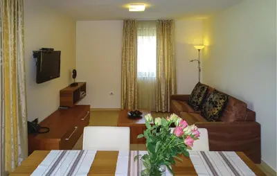 a living room with a couch and a table at Stunning Apartment In Lasko With Wifi in Laško