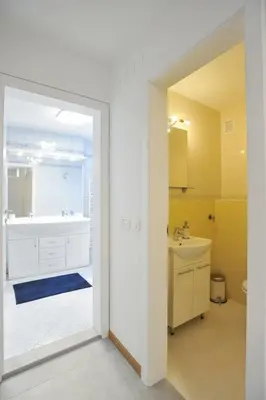 a bathroom with a tub and a sink at Strict city apartments in Ljubljana