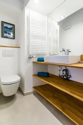 a bathroom with a sink and a toilet at Barrio Alto in Ljubljana