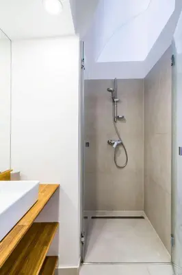 a bathroom with a shower and a sink at Barrio Alto in Ljubljana