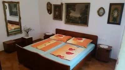 a bedroom with a bed with two pillows on it at Apartment Tatjana in Ljubljana