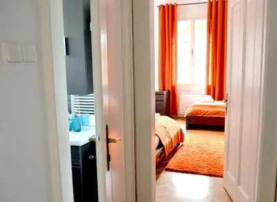 a room with a bedroom with a bed and a window at Apartment Soul in Ljubljana