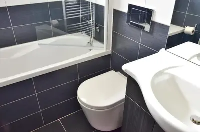 a bathroom with a toilet and a sink at Apartment Soul in Ljubljana