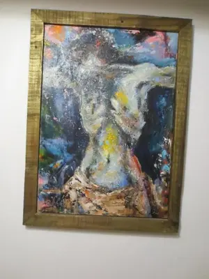 a painting of a woman on a wall at Gostišče Smuk in Križe