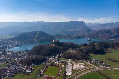 an aerial view of a town and a lake at Apartments ApArt Bled in Bled