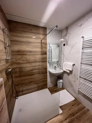 a bathroom with a sink and a mirror at Prenočišča Mraz in Velenje