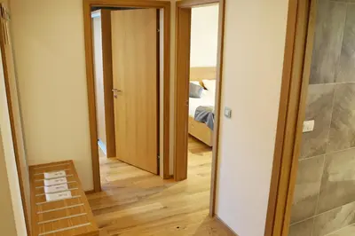 a hallway with a door leading to a bedroom at Pan Prenočišča in Ptuj