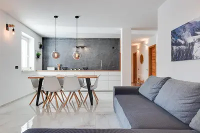 a living room with a couch and a table at Apartments Julian Explore in Rateče