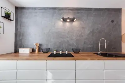 a kitchen with a counter with a sink at Apartments Julian Explore in Rateče