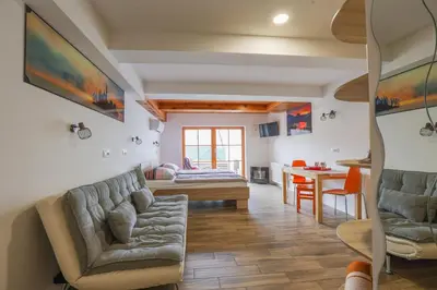 a living room with a couch and a table at Jazz Bled Guest House in Bled