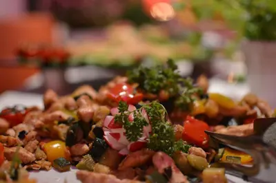 a plate of food with broccoli and other vegetables at Hotel Dolenjc in Novo Mesto