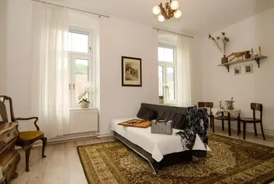 a living room with a couch and a table at Trubarjev Art Boutique hotel in Laško
