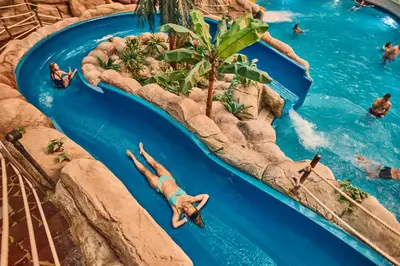 a group of people on a water slide at a water park at Terme Village - Mobile Homes in Čatež ob Savi