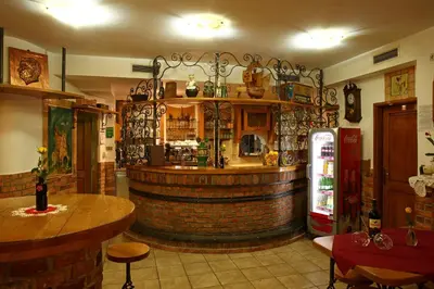 a bar in a restaurant with a wine barrel at Gostilna in prenočišča Gedžo in Novo Mesto