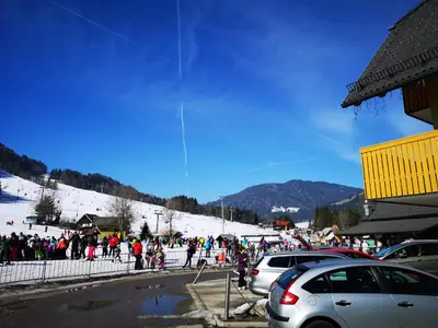 a large group of people on a ski slope at Apartment Maša in Kranjska Gora