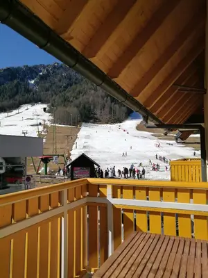 a view of a ski slope from the balcony of a ski lodge at Apartment Maša in Kranjska Gora
