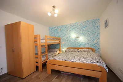 a small bedroom with a bunk bed and a bunk bed gmaxwell gmaxwell gmaxwell at Danijela & Gregor in Rateče