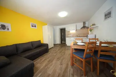 a living room with a couch and a table at Danijela & Gregor in Rateče