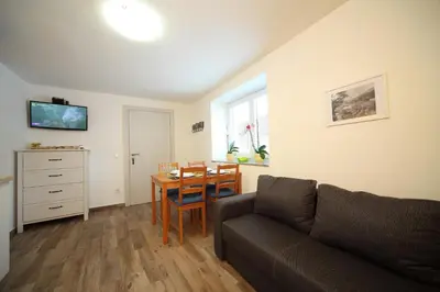 a living room with a couch and a table at Danijela & Gregor in Rateče