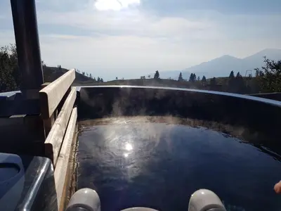 a pool of water on the side of a vehicle at Chalet Encijan - Velika planina in Stahovica