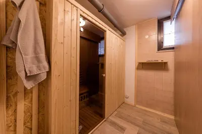 a bathroom with a walk in shower next to a door at Cosy Hill Home Rucman With a Breathtaking View in Zgornja Pohanca