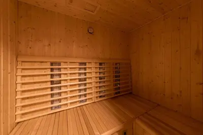 a wooden room with a sauna in a cabin at Cosy Hill Home Rucman With a Breathtaking View in Zgornja Pohanca