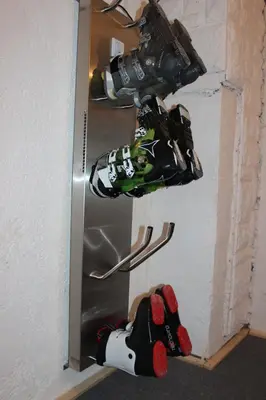 a man in a gas mask hanging from a refrigerator at PONI NAKLO - Sobe Marinšek in Naklo