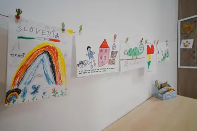 a room with drawings on the wall of a room at Pri Neji in Postojna