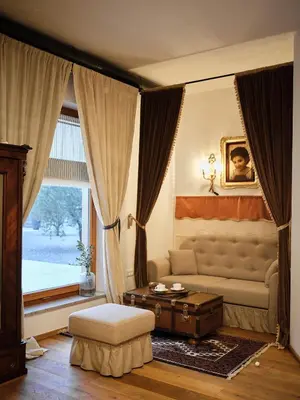 a living room with a couch and a table at HOTEL StDaniel in Štanjel