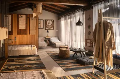a living room filled with furniture and a table at HOTEL StDaniel in Štanjel