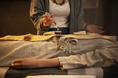 a woman eating food on top of a table at HOTEL StDaniel in Štanjel