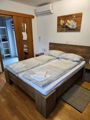 a bedroom with a large bed in a room at Gorenjka in Kranjska Gora