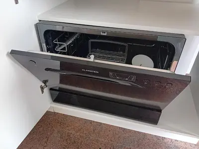 a microwave oven sitting inside of a wall at Dolenjska vila with Private Sauna in Žužemberk