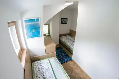 a small room with a bed and a box at A Million Dollar View in Kranjska Gora