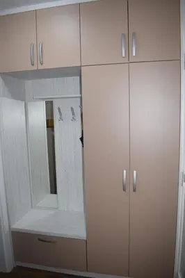 a white closet with a mirror and white cabinets at Borovnica Čatež in Čatež ob Savi