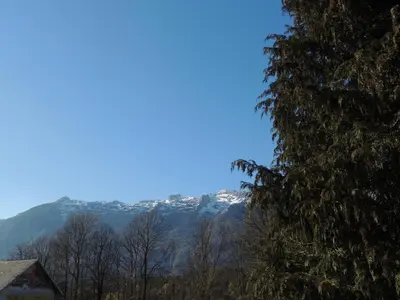 a view of a snow covered mountain in the distance at Apartma Lesjak 1 in Bovec