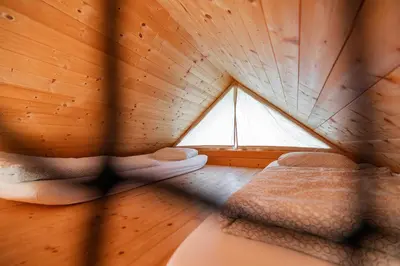 a room with two beds and a window at Glamping Kolpa Resort in Gradac