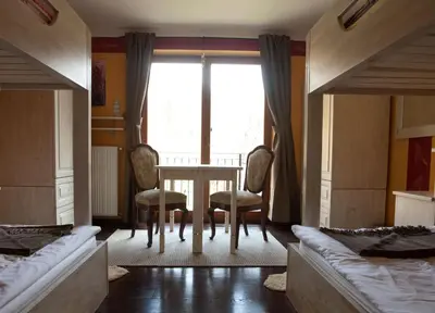 a dining room with a table and chairs and a window at Turistična kmetija Weiss in Miklavž pri Taboru