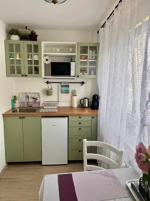 a small kitchen with a sink and a microwave at Villa Mint&Lavender ID1O1674 in Bled