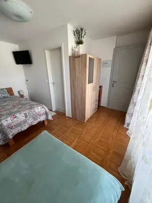 a bedroom with a bed and a wooden floor at Villa Mint&Lavender ID1O1674 in Bled