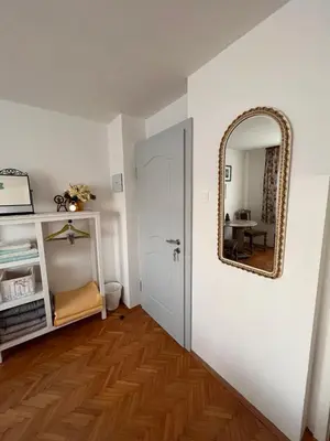 a hallway with a mirror and a white door at Villa Mint&Lavender ID1O1674 in Bled