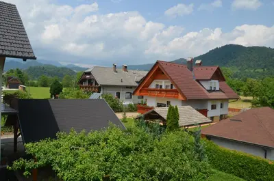 a group of houses with mountains in the background at Villa Mint&Lavender ID1O1674 in Bled