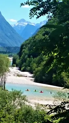 a painting of people swimming in a river at Holiday Home Julian Alps in Bovec